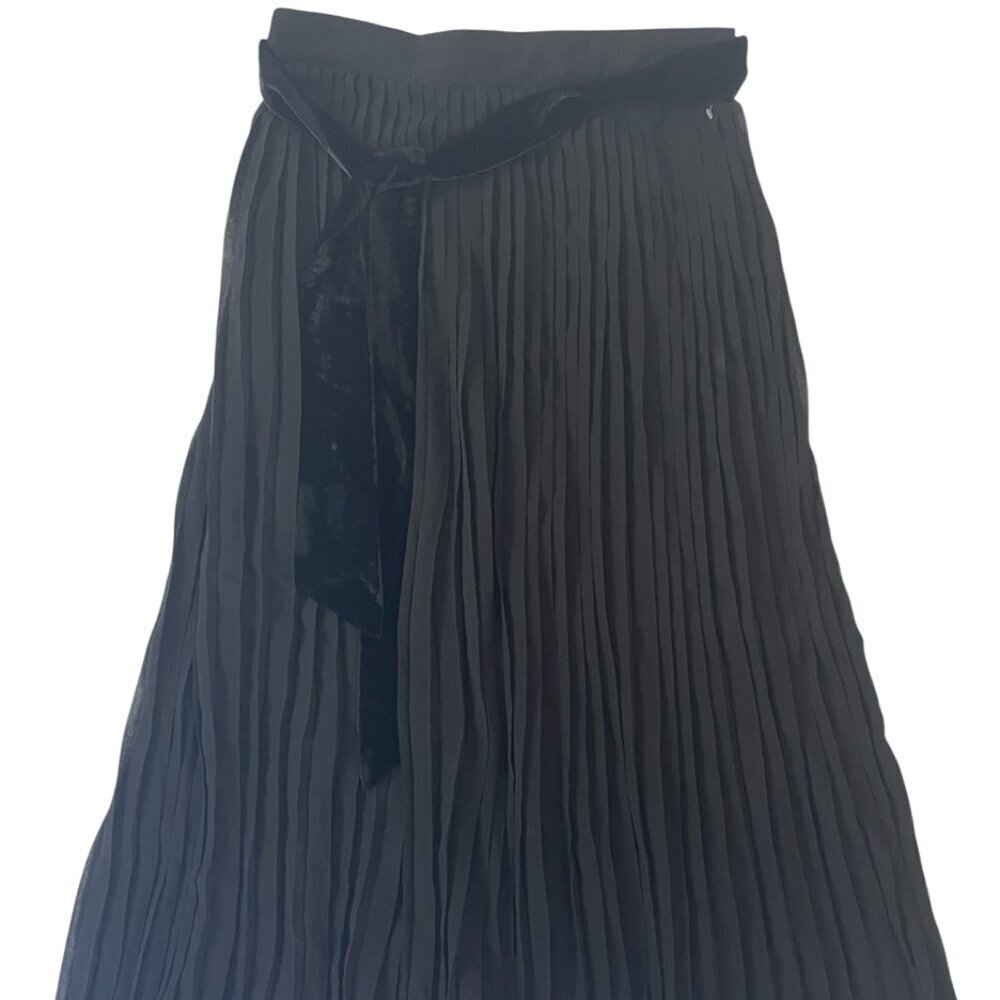 Amelie House. Long black pleated women's dress. Polyester. Made in China.